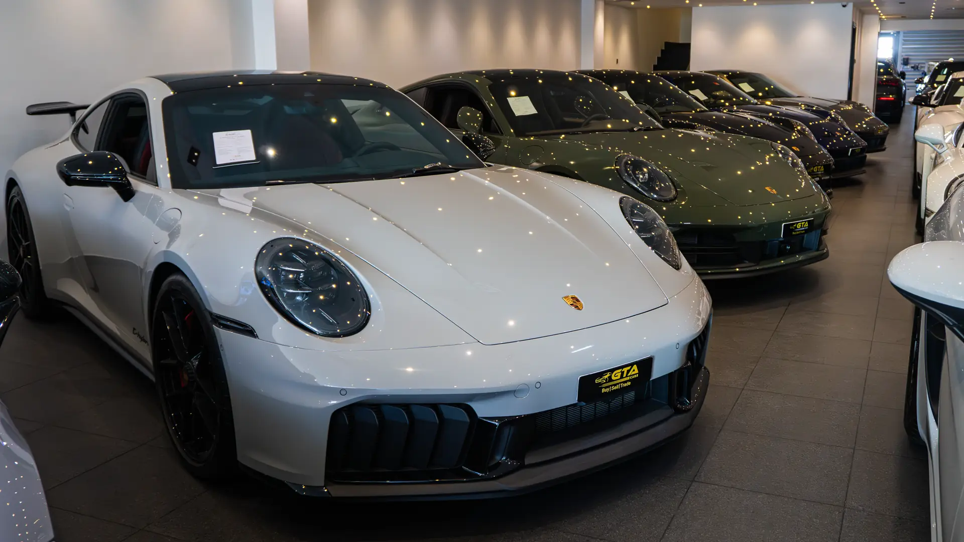 White Porsche 911 GT3 among pre-owned sports cars in the GTA Cars Dubai showroom