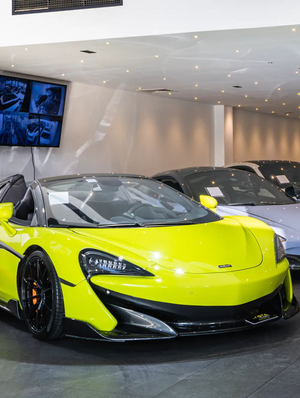 Lime green McLaren 600LT Spider in the GTA Cars showroom, Dubai